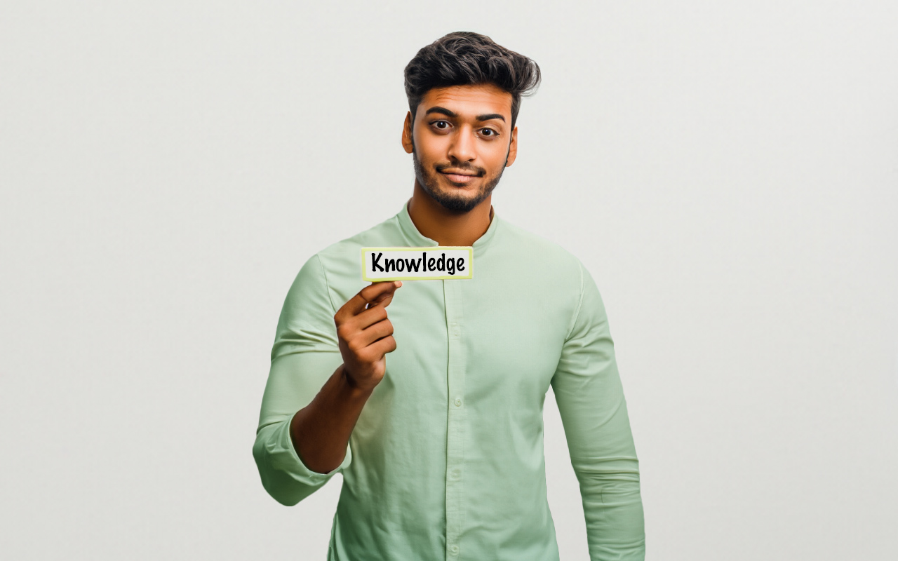 Indian_man_holding_a_card_with_green_shirt_how_to_gain_knowledge